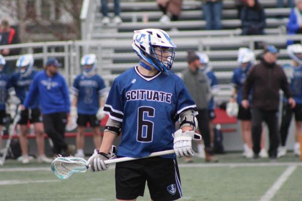 Scituate High School lacrosse player Quinn DeCourcey plays with the Q-Collar. 